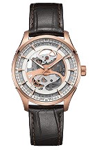 A luxurious wristwatch with a rose gold case and black leather strap.