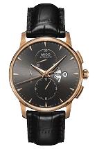 Elegant wristwatch with a black face, silver markers, and sub-dials. Gold casing with a black leather strap,
